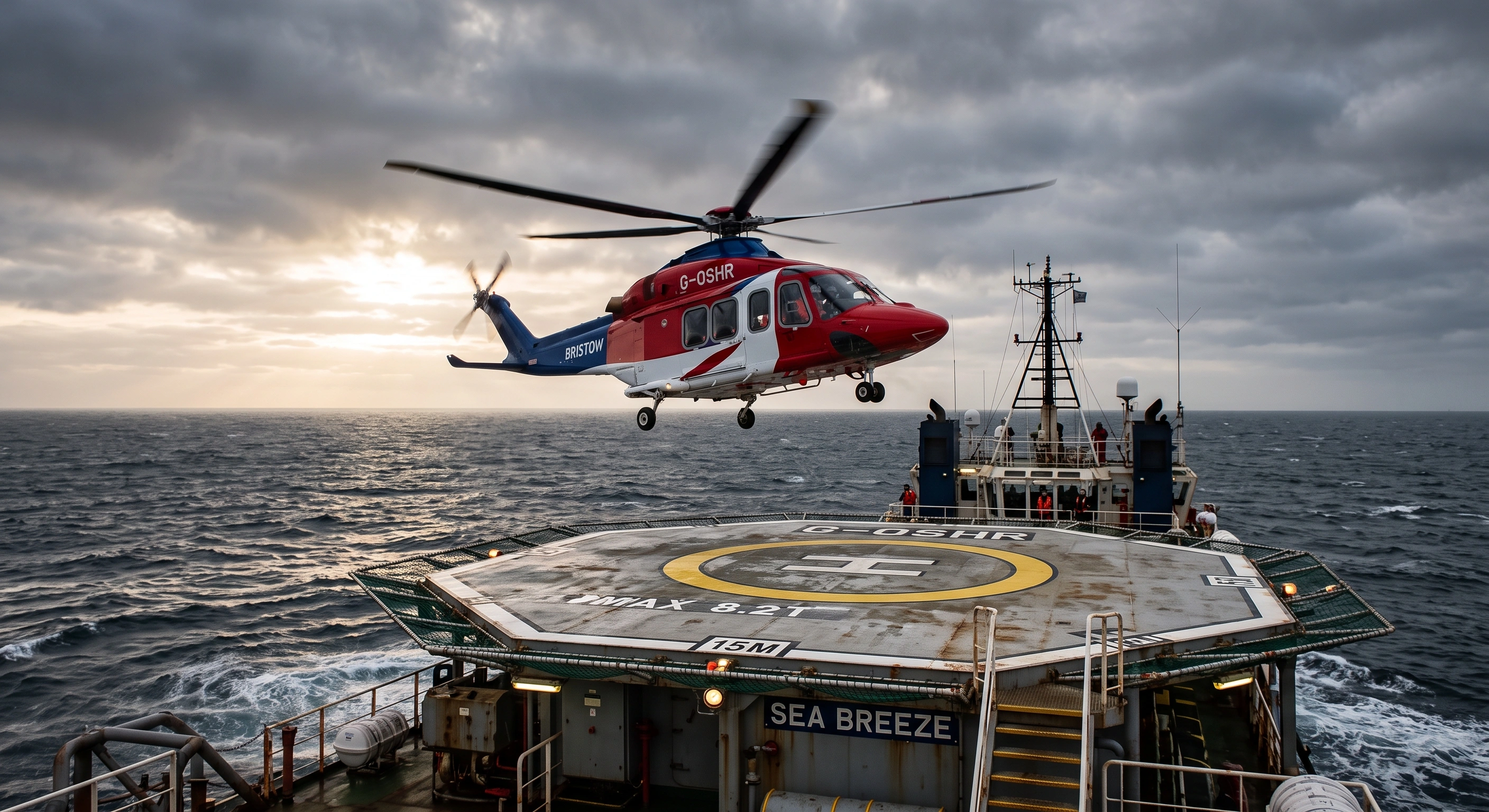 A helicopter coming in over an offshore helideck at sea